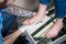 The hands of a young man doctor orthopedist conducts diagnostics, foot foot test of a woman, for the manufacture of individual, or