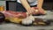 Hands of young woman kneading dough on the table