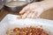 The hands of the young woman are making Steamed tapioca dumpling balls with pork is dessert.