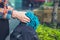 Hands of young woman opening rucksack