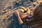 Hands of a young woman in a striped dress, colorful scarf and yellow boots with the Mehndi inscriptions `Viva la Vida` and treble