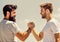 Handshake arm wrestling style. Strong and muscular arms. Successful deal handshake blue sky background. Men shaking
