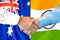 Handshake on Australia and India flag background