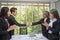 Handshake. Business associate shaking hands in office. Two businessmen shaking hands in office. asian. The office. presentation