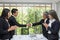 Handshake. Business associate shaking hands in office. Two businessmen shaking hands in office. asian. The office. presentation w