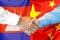 Handshake on Cambodia and China flag background. Support concept