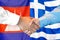 Handshake on Cambodia and Greece flag background. Support concept