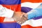 Handshake on Cambodia and Thailand flag background. Support concept