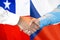 Handshake on Chile and Czech Republic flag background