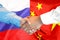 Handshake on China and Russia flag background