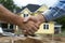 handshake with contractor with Home renovation, handshake of an architect and a builder on the background of a built house,