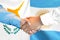 Handshake on Cyprus and Argentina flag background