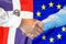 Handshake on Dominican Republic and EU flag background. Support concept