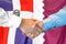 Handshake on Dominican Republic and Qatar flag background. Support concept