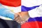 Handshake on Egypt and Russia flag background