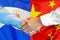 Handshake on El Salvador and China flag background. Support concept