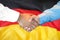 Handshake on Germany flag background