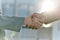 Handshake, greeting and meeting business people in an agreement or partnership in unity, trust and support. Closeup of