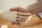 Handshake of human hand and wooden prosthesis in rehabilitation center closeup