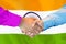 Handshake on India flag background