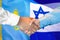 Handshake on Kazakhstan and Israel flag background. Support concept