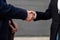 handshake between a man and a woman closing a deal