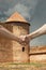 Handshake with medieval fort