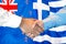 Handshake on New Zealand and Greece flag background