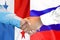 Handshake on Panama and Russia flag background