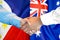 Handshake on Philippines and Australia flag background