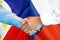Handshake on Philippines and Czech Republic flag background