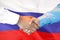 Handshake on Russia flag background