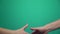 Handshake, shaking hands, handshaking. Two handed gesture. Chromakey. Green Screen