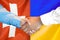 Handshake on Switzerland and Ukraine flag background