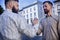 Handshake of two bearded hipster friends as symbol of male strong friendship