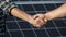 Handshake of two businessmen on a background surface of solar panels