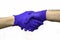 Handshake of two hands in protective hygienic surgical gloves in blue on the white background