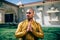 Handsom Indian Man Greeting Namaste in Gold Kurta at the Temple