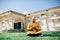 Handsom Indian Man Greeting Namaste in Gold Kurta at the Temple