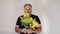 Handsom mature bearded man smiling and giving mimosa flower to viewer. Man with bouquet.Holiday concept. Slow motion