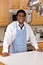 Handsome African-American businessman in kitchen