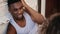 Handsome african man in pajamas posing to photographer. Portrait of young male on photoshoot in loft apartment.