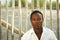 Handsome african man sitting outdoors alone