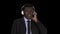 Handsome Afro American businessman in headphones is listening to music, Alpha Channel