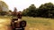 Handsome American WWII GI Army officer in uniform stands on Willy jeep and salutes