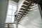 handsome architect in white shirt going upstairs inside of