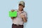 handsome asian boy with scout uniform pointing a book