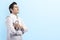 Handsome asian doctor man in white lab coat and stethoscope crossed arms