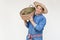 Handsome Asian man farmer wears hat, blue shirt, holds basket of durian fruits