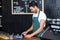 Handsome barista using cash register